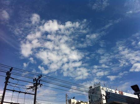 Blue sky with clouds close upの素材