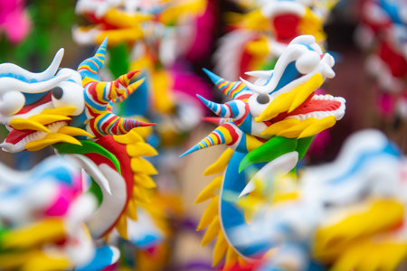 Colorful toy figurines made from glutinous rice powder, a traditional Vietnamese craftの写真素材