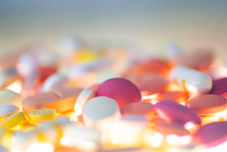 Colorful pills and capsules on white background. Focus on foreground.の写真素材