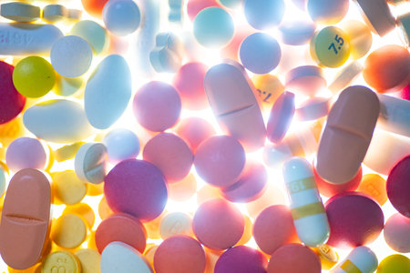 Colorful pills on white background. Focus on foreground, soft bokeh.の写真素材