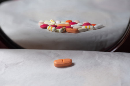 Colorful pills and capsules on a white background, close-upの写真素材