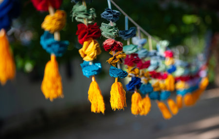 Colorful handmade paper lanterns hanging on the street.の写真素材