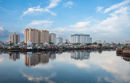 Bangkok cityscape with reflection on Chao Phraya River.