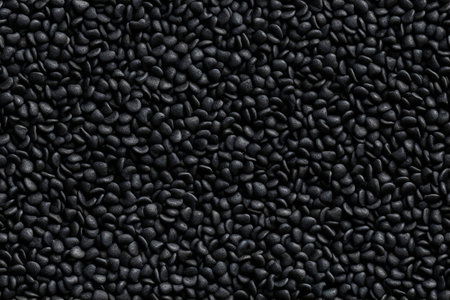 Black sesame seeds background. Black sesame seeds texture. Top view.の素材