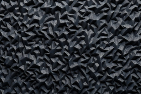 Close up of textured surface of black concrete wall for background.の素材