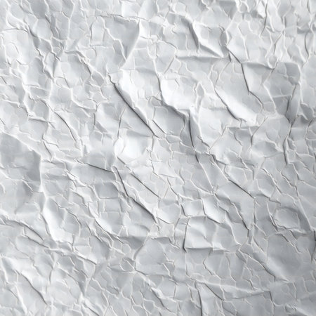 White crumpled paper as a background texture pattern. Close upの素材