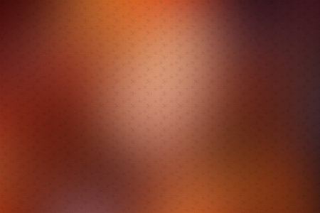 Abstract background with halftone dots in orange and brown colors.の素材