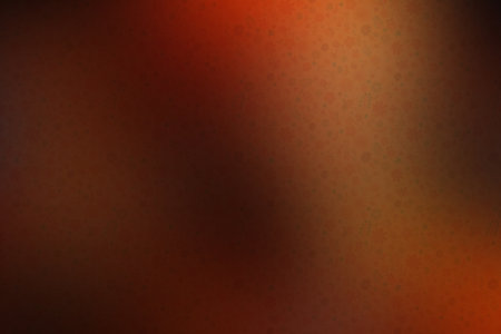 Abstract background with bokeh defocused lights in orange and brown colorsの素材