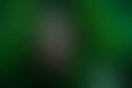 abstract green background with some smooth lines in it and some spots on itの素材