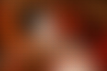 Abstract background with a pattern of squares in red and orange colors.の素材