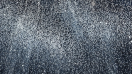 The texture of the asphalt is covered with snow. Winter background.の素材
