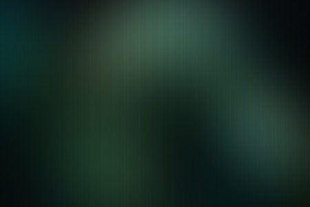 abstract background with green bokeh defocused lights and shadowの素材