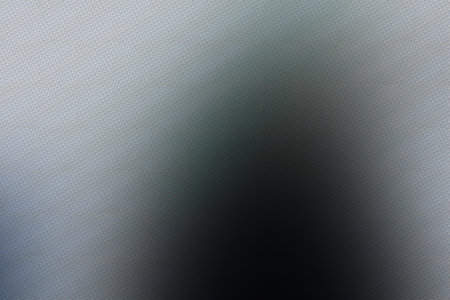 abstract background with blurred spots of light in gray and black colorsの写真素材
