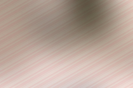 abstract background with diagonal stripes in pink and beige colors.の写真素材