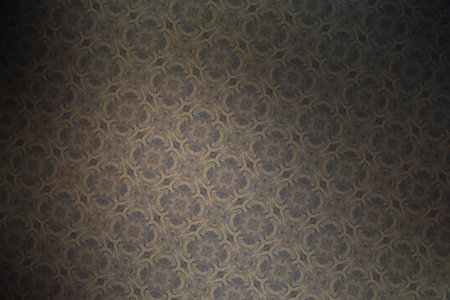 Arabesque pattern on brown background.