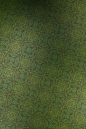 Textile cloth green with a kaleidoscope pattern in it.