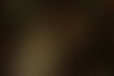 abstract brown background texture with some smooth lines in it and some spots on itの写真素材