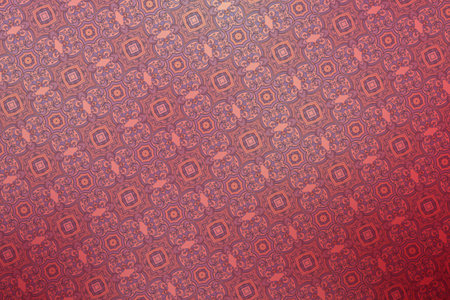 abstract background with a pattern of geometric shapes on a red background