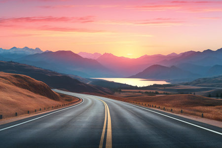 Asphalt road in the mountains at sunset. Travel and adventure concept.の素材