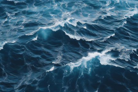 Blue sea water surface with waves and foam as background, top viewの素材