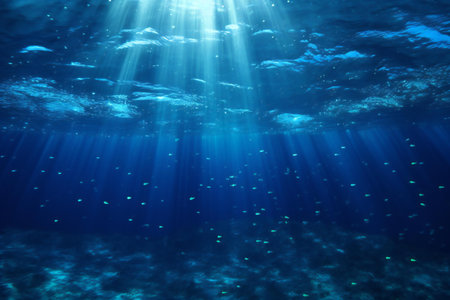 Underwater view of the coral reef with fish and rays of lightの素材