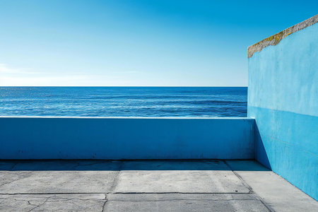 Blue wall and concrete floor with sea view, blue sea background.の素材