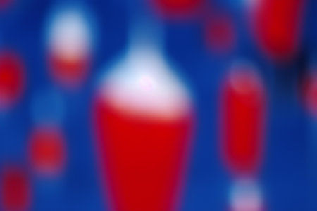 abstract blue and red background with bokeh defocused lightsの素材