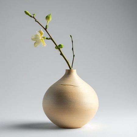 White orchids in a wooden vase on a gray backgroundの素材