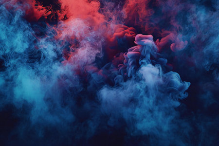 Dense multicolored smoke of  red and blue colors on a black isolated background. Background from the smoke of vapeの素材