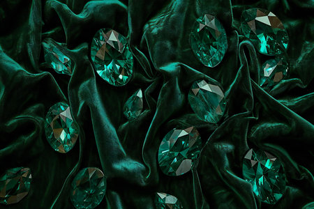 Diamonds on green satin background.の素材