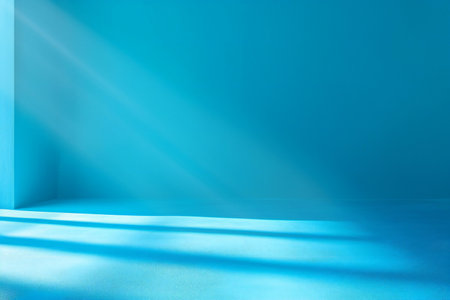 Abstract blue background with light rays from the window.の素材