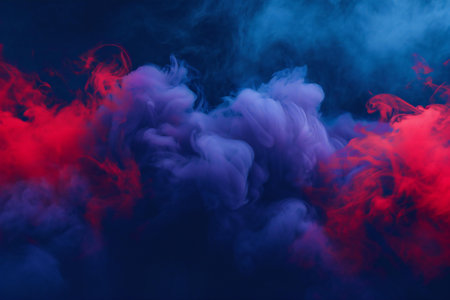Red and blue cloud of smoke on a black isolated background. Background from the smoke of vapeの素材