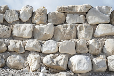 Background of stone wall texture. Natural stone wall background for design.の素材
