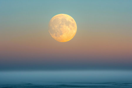 Full moon over the sea at sunrise, natural background with copy spaceの素材