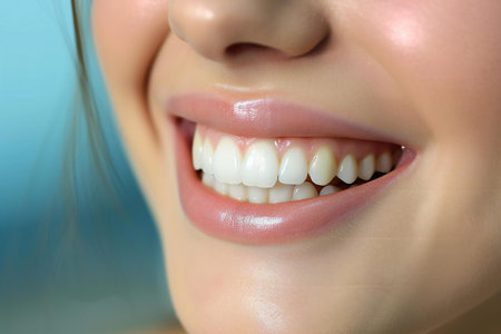 Close-up of beautiful smiling young woman teeth. Dentistry conceptの素材