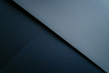 Abstract black and blue background. Close up of dark paper texture.の素材