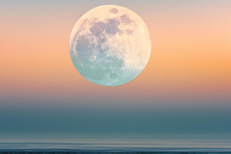 Full moon over the sea at sunset. Beautiful nature landscape with full moon.の素材