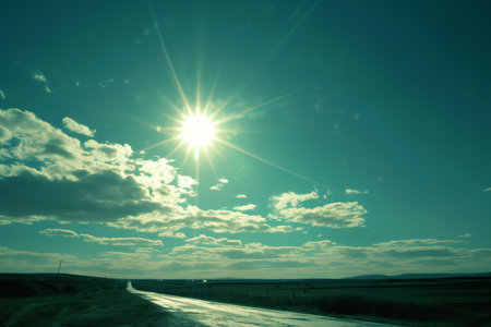 sunset over the road in the steppe, blue sky and cloudsの素材