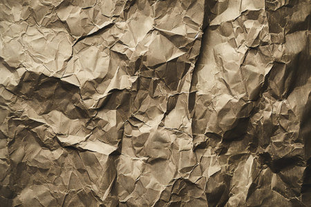 Crumpled paper background. Brown crumpled paper texture.の素材