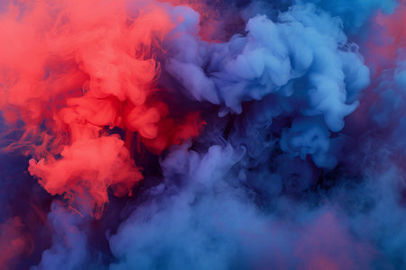 Red and blue steam on a black isolated background. Background from the smoke of vapeの素材