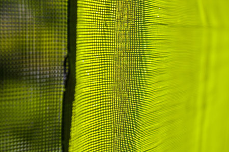 Close up of green netting on a tennis court. Abstract backgroundの素材