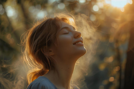 Portrait of a beautiful girl in the rays of the setting sunの素材