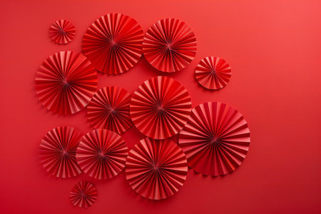 Paper fans on a red background.の素材