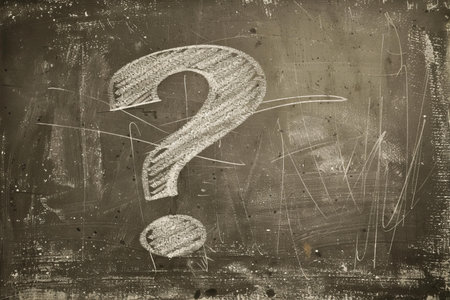 Question mark painted on a blackboard. Grunge background.の写真素材