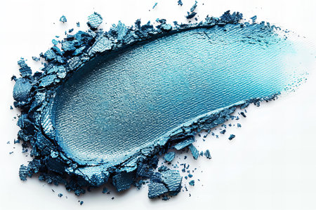 Crushed blue eyeshadow as sample of cosmetic product isolated on white backgroundの写真素材