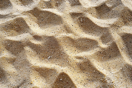 Texture of sand on the beach. Abstract background and texture for design.