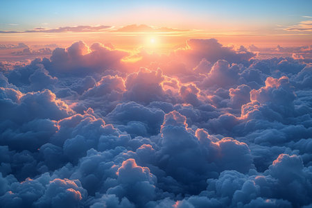 Aerial view of beautiful sunset above clouds. Colorful sky background.