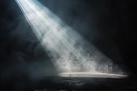 Dark scene with spotlights and smoke. Rays of light in the darkの写真素材