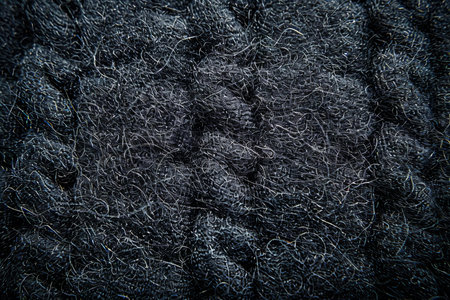 Closeup detail of grey woolen fabric texture background. Macro.