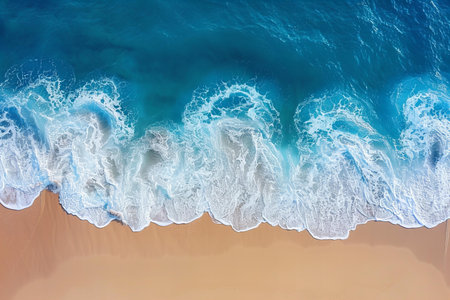 Aerial view of beautiful sandy beach with turquoise ocean waves